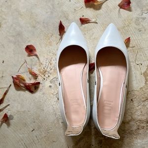 White leather pumps